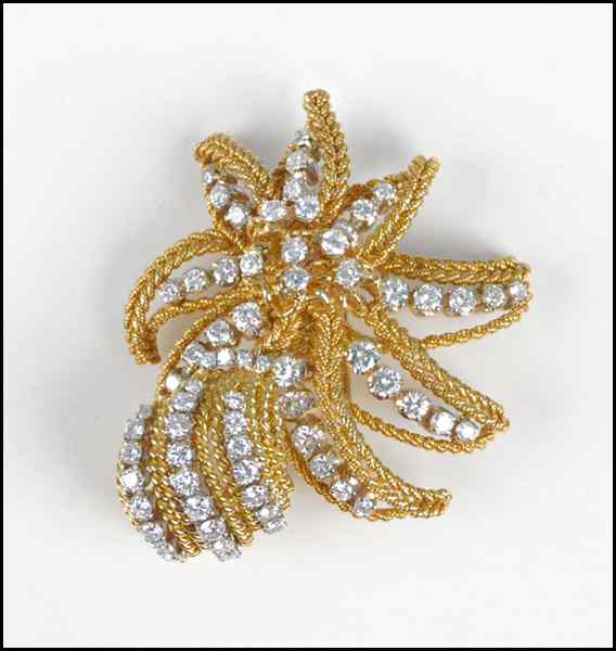 Appraisal: DIAMOND AND KARAT YELLOW GOLD CLIP BROOCH round brilliant diamonds