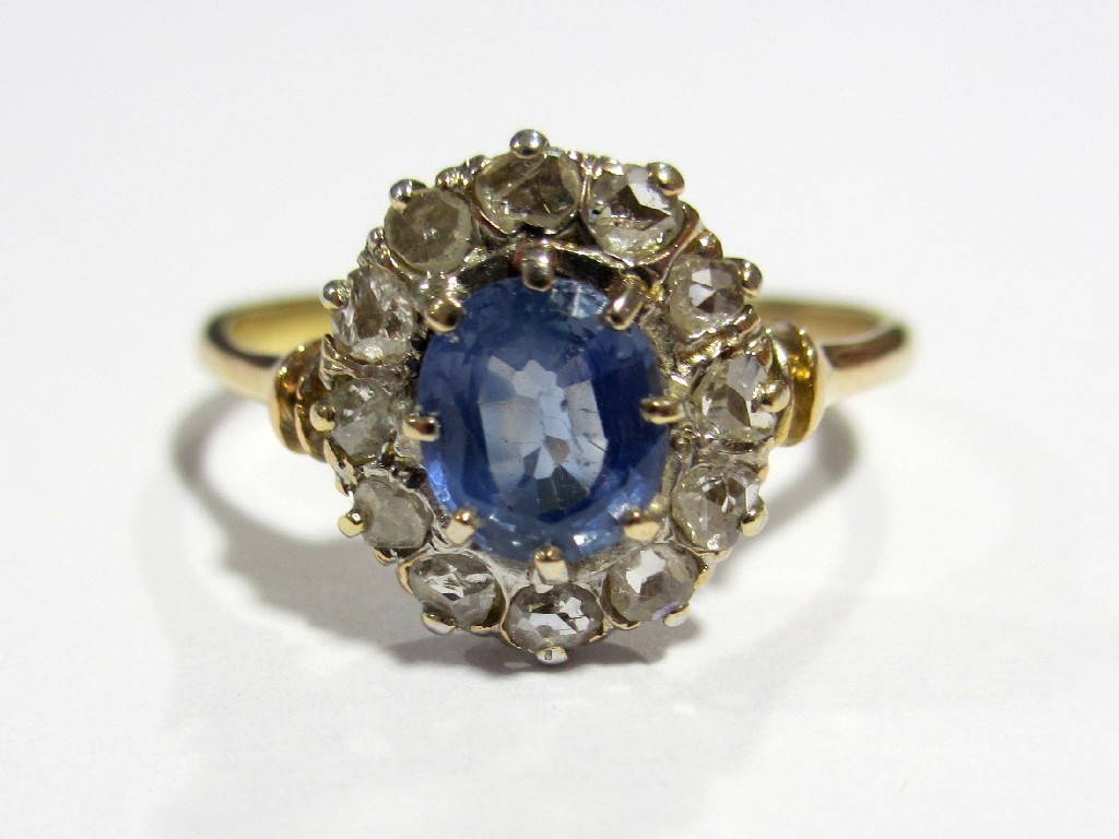 Appraisal: An Edwardian ct gold Ceylon sapphire and diamond cluster ring