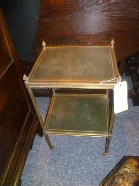 Appraisal: A SMALL BRASS TWO TIER STAND on column supports with