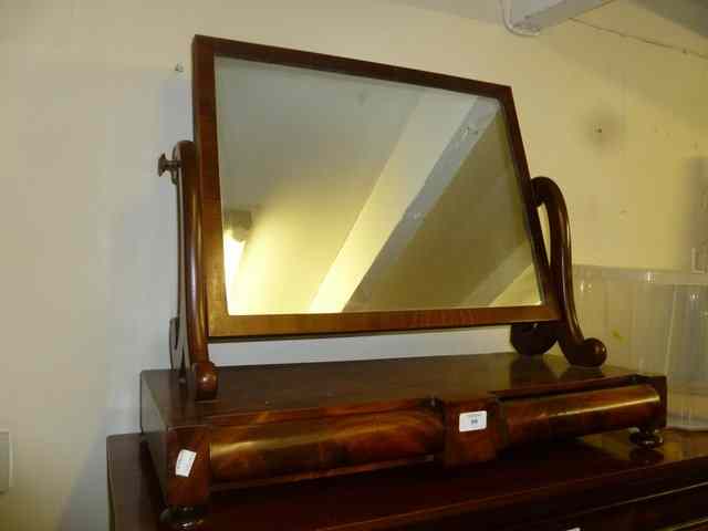 Appraisal: A VICTORIAN MAHOGANY DRESSING TABLE MIRROR with swing motion shaped