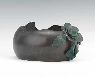 Appraisal: A Bronze Planter Bronze with brown patina applied bronze flower