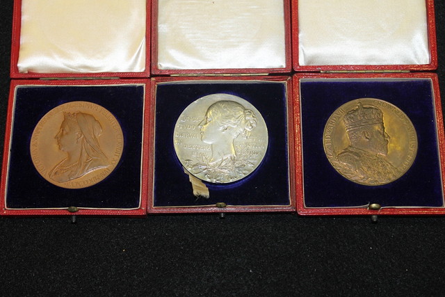 Appraisal: A COLLECTION OF THREE COMMEMORATIVE MEDALLIONS of Coronations of Queen