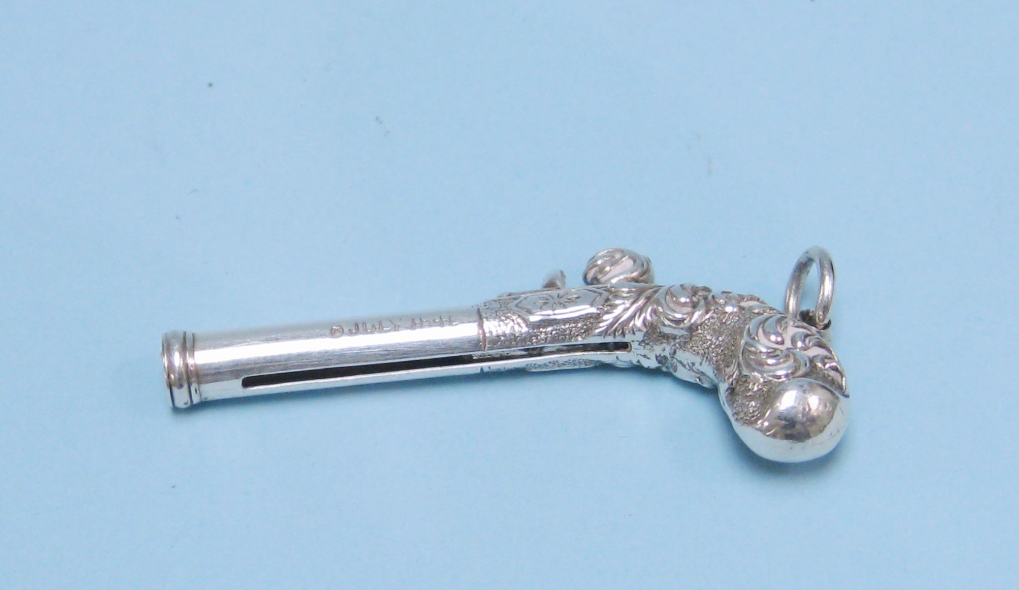 Appraisal: A miniature silver Pendant Toothpick in the form of a