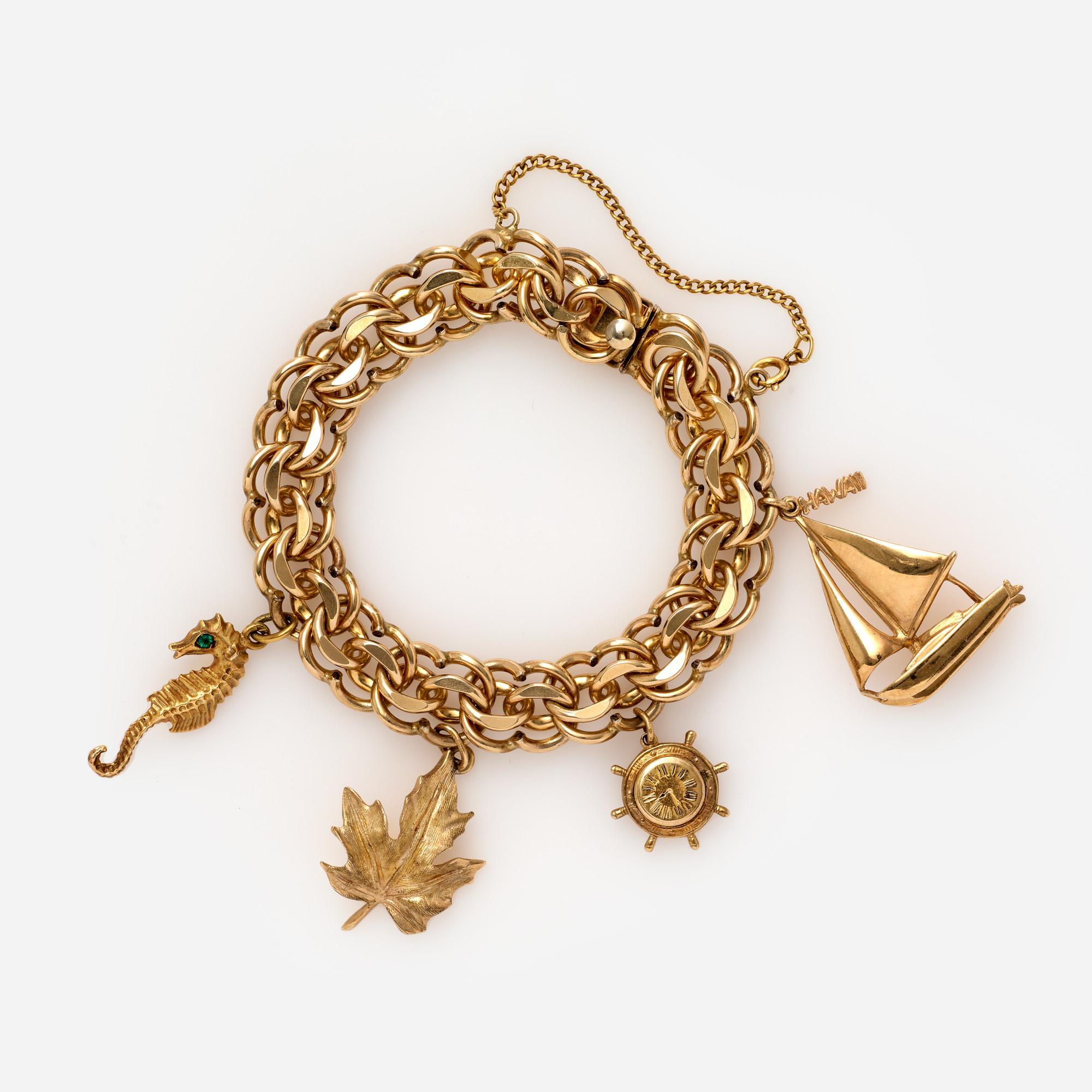 Appraisal: LARGE WINARD CHARM BRACELET WITH GOLD CHARMS A thick gold