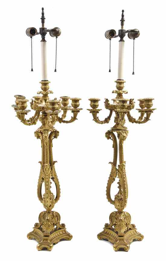 Appraisal: A Pair of Continental Gilt Bronze Seven-Light Candelabra each open