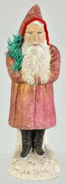 Appraisal: German Belsnickel Santa Description In red holding a fir tree