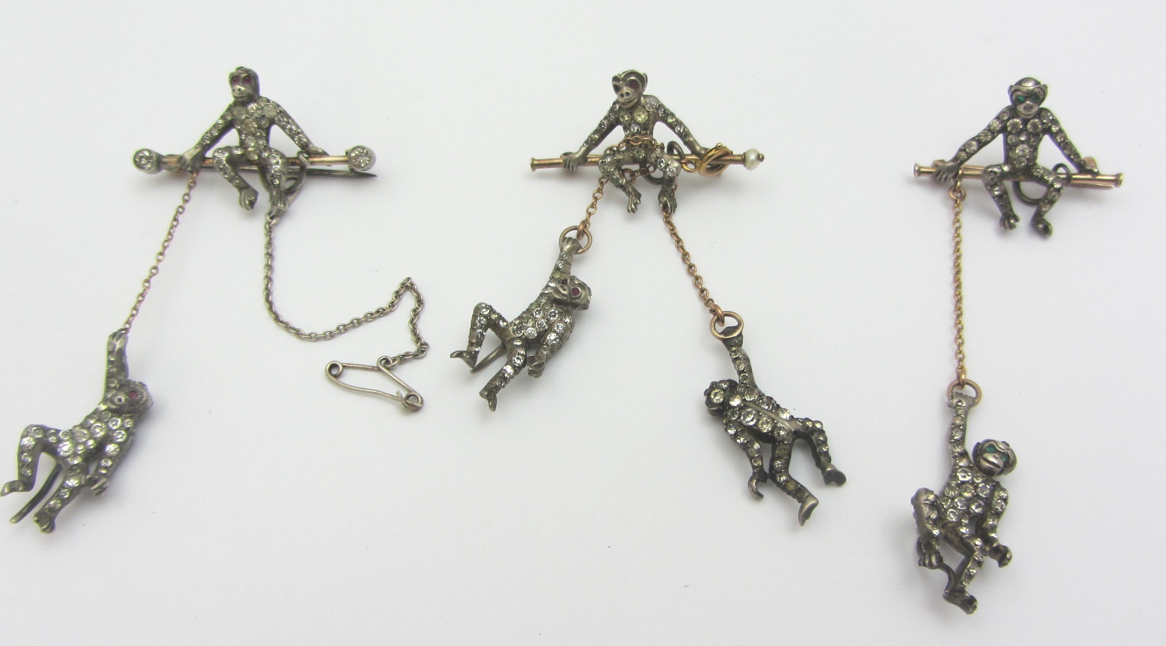 Appraisal: A colourless paste set brooch formed as a monkey seated