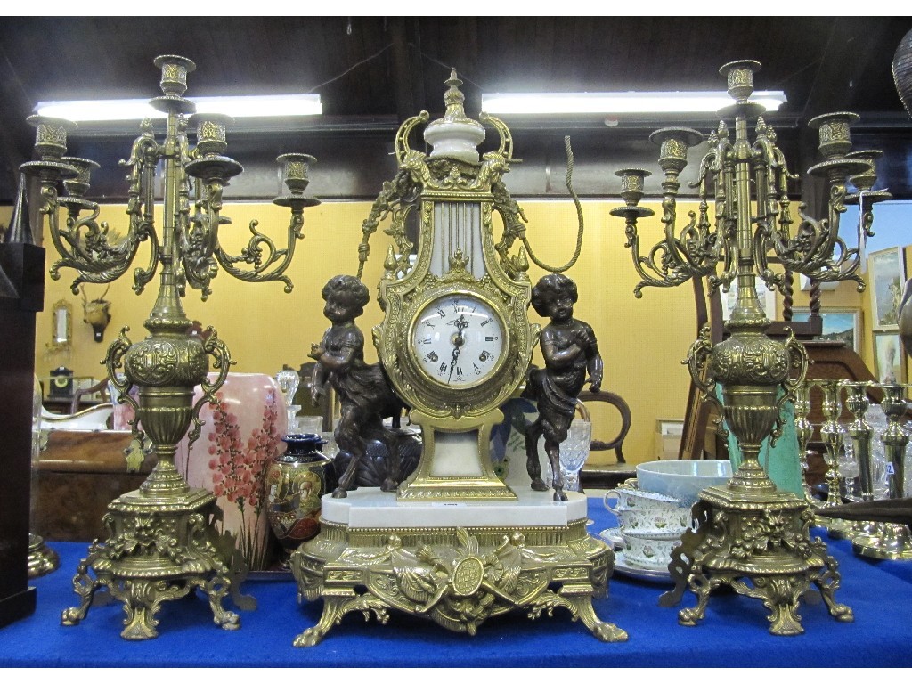 Appraisal: Gilt metal clock garniture