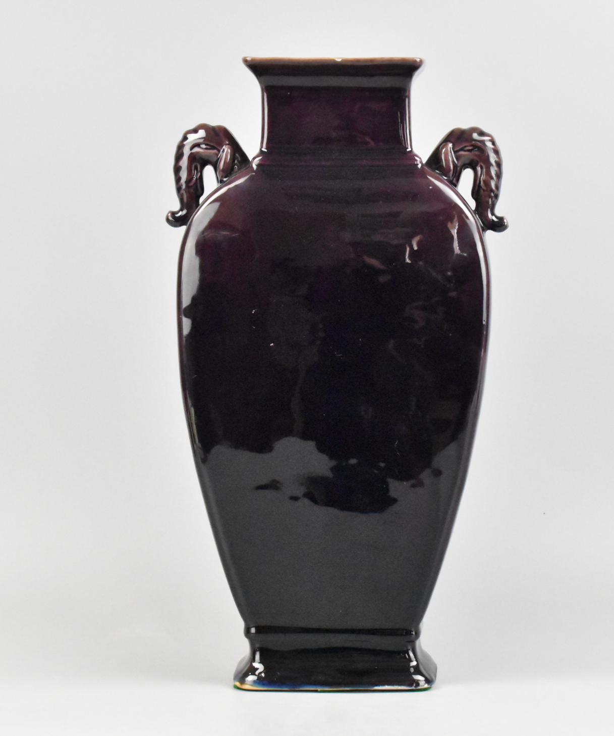 Appraisal: A Chinese purple glazed vase with elephant trunk handles dating