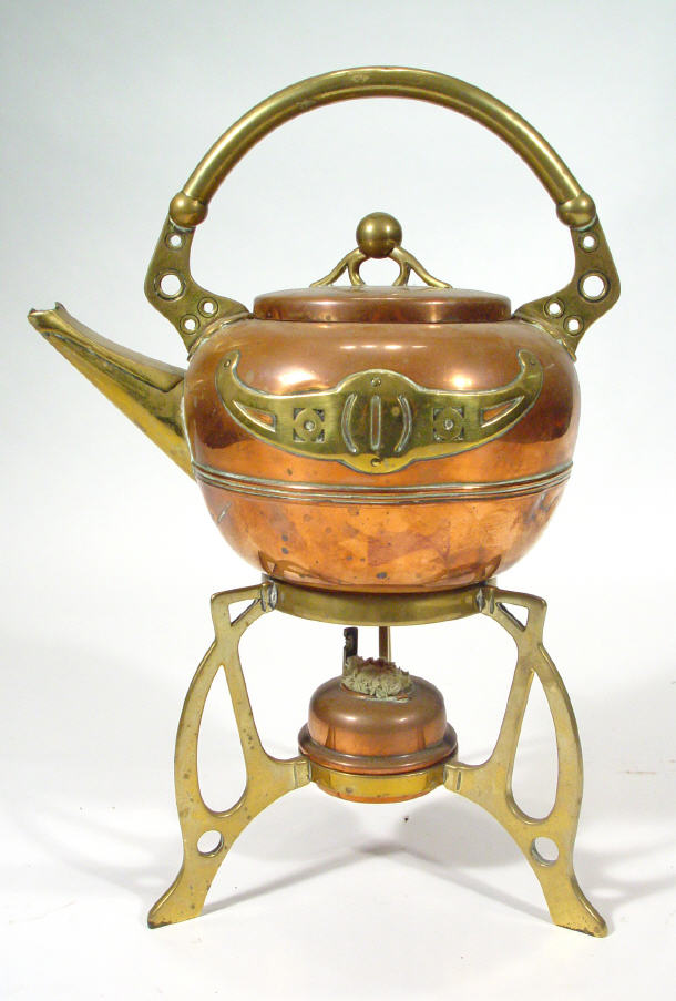 Appraisal: Art Nouveau brass and coper kettle on stand with burner