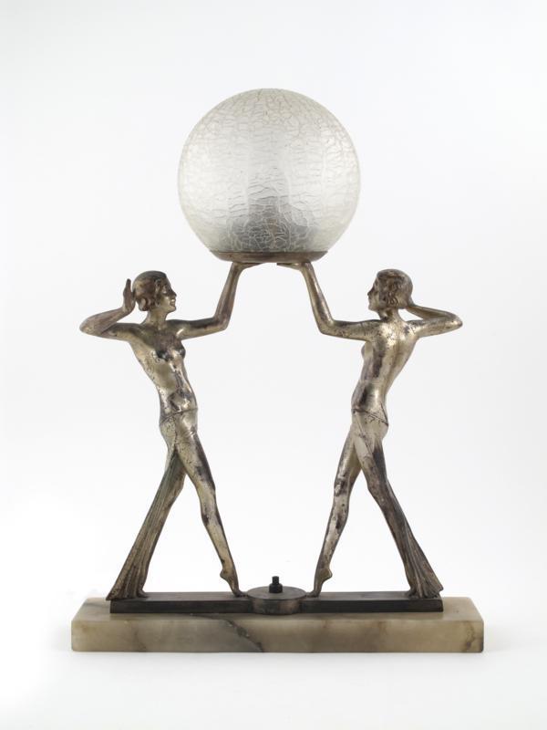 Appraisal: A patinated metal double dancer lamp base