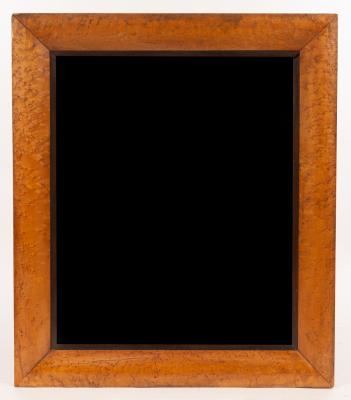 Appraisal: A rectangular wall mirror with bevelled plate in a bird's