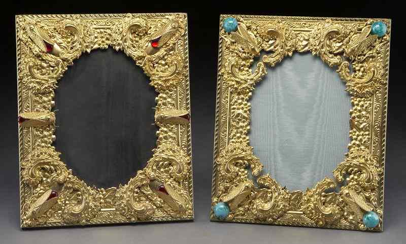 Appraisal: Pr Gilt metal frames featuring floral scrollsand crickets with colored