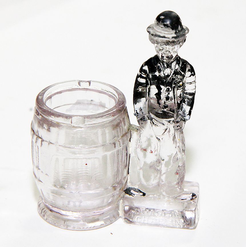 Appraisal: Charlie Chaplin Candy Container Glass container with no closure and