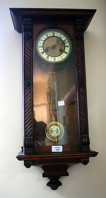 Appraisal: A MID TH CENTURY WALNUT CASED WALL CLOCK the white