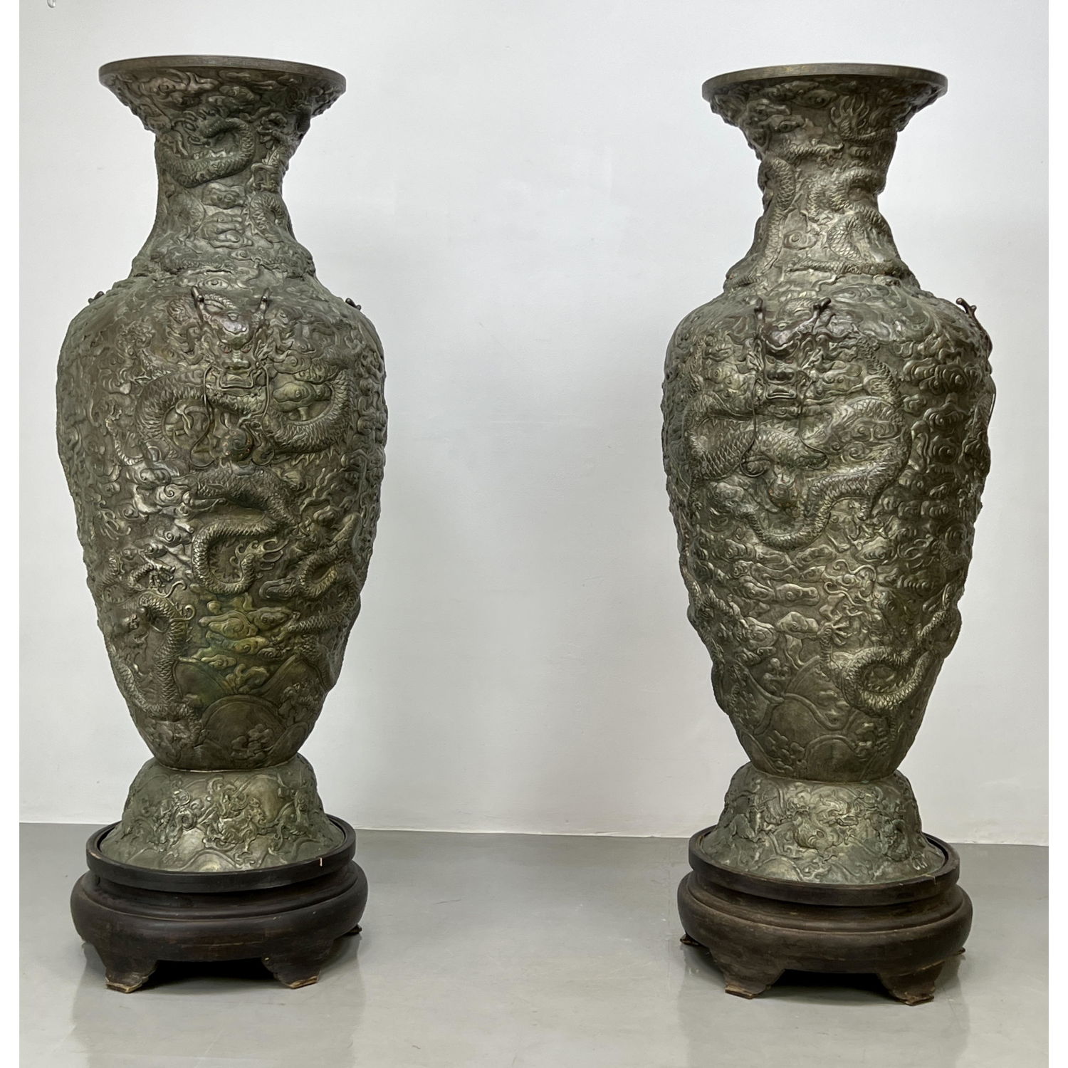 Appraisal: Pr foot Tall Metal Urns Vases Overall relief design of