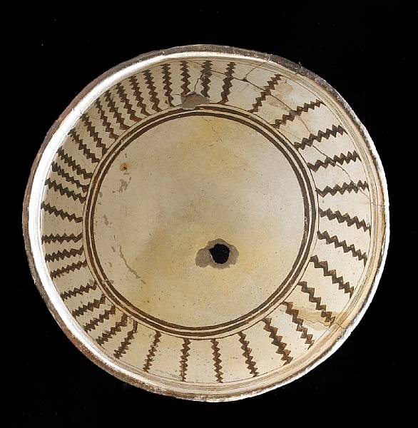 Appraisal: A Mimbres black-on-white bowl Showing a series of vertical zigzag