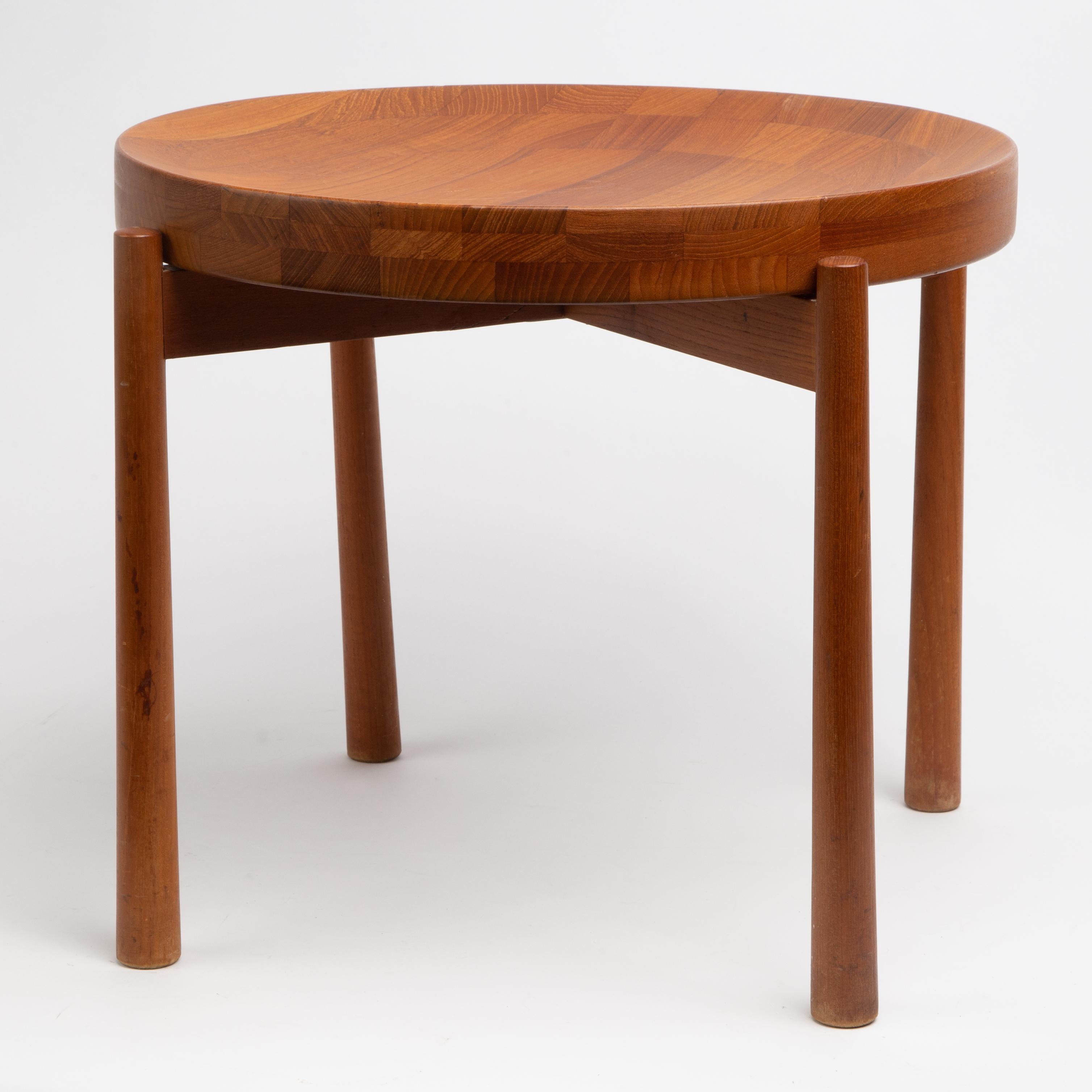 Appraisal: JENS QUISTGAARD TEAK TRAY TABLE A Jens Quistgaard designed teak