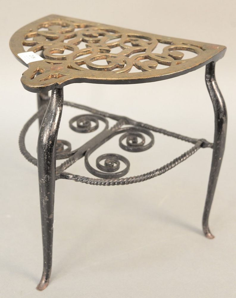 Appraisal: Brass and iron trivet pierced top with turned and scroll