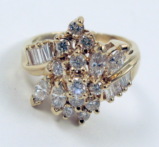 Appraisal: DIAMOND AND FOURTEEN KARAT GOLD RING with a cluster of