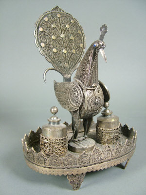 Appraisal: A th century Indian filigree silver peacock perfume bottle stand