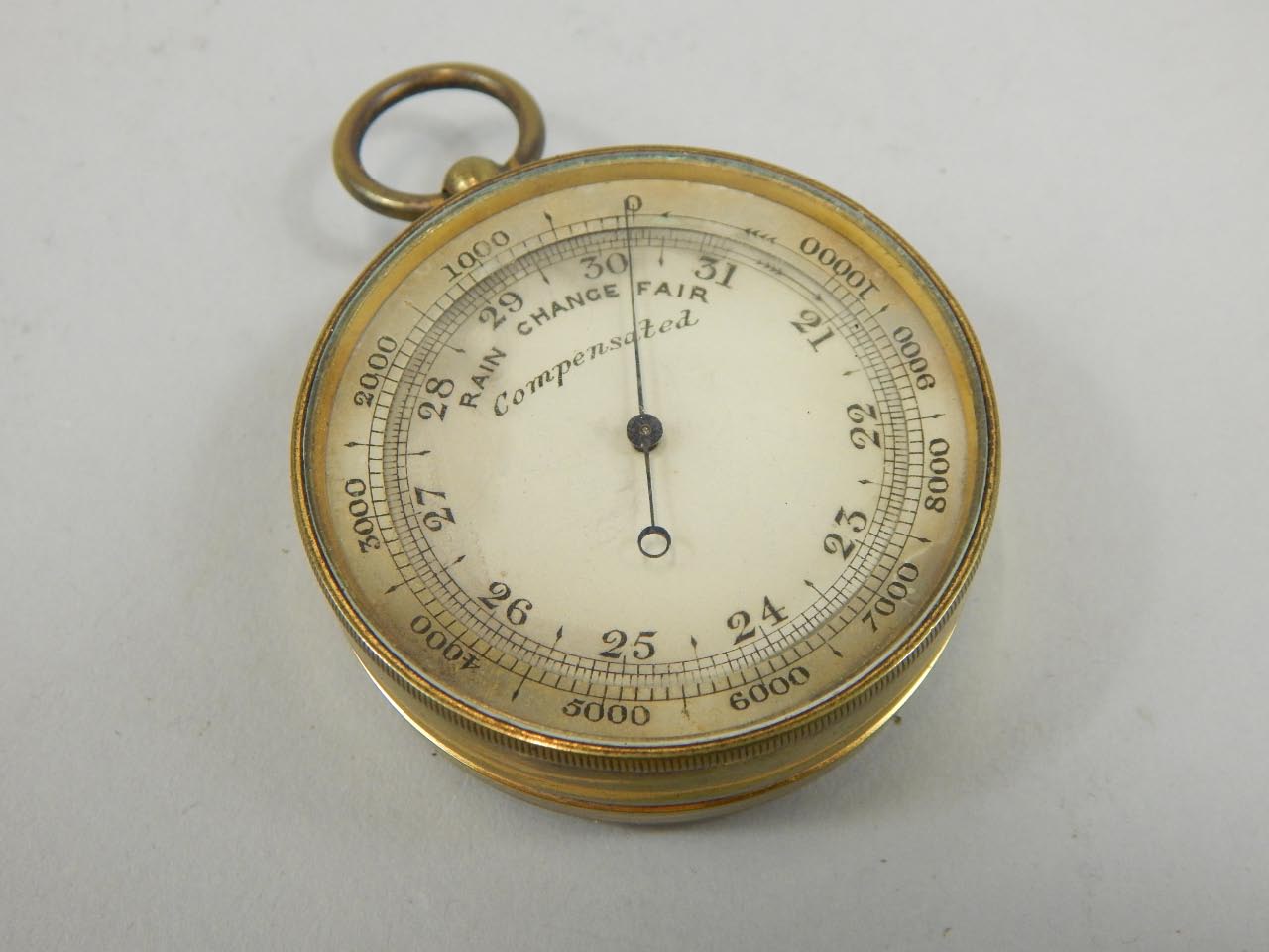 Appraisal: A pocket barometer in yellow metal case probably early thC