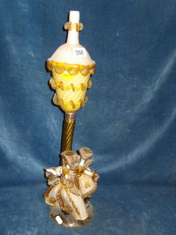 Appraisal: A Venetian glass lamp base with amber and cream colouring