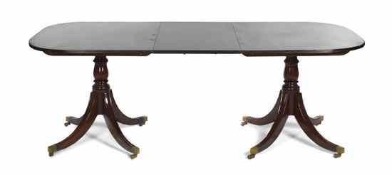 Appraisal: A Georgian Style Mahogany Double Pedestal Extension Table having a