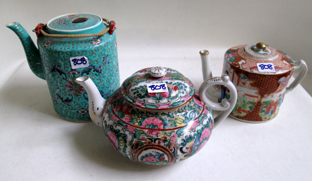 Appraisal: THREE ORIENTAL TEAPOTS in Kutani Rose Canton and Famille Verte