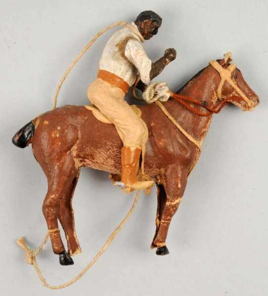 Appraisal: German Dresden Horse Rider Ornament Description Bends to horse's legs