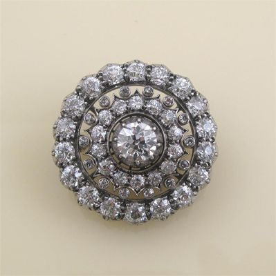 Appraisal: A Victorian diamond target brooch Centred with a circular cut