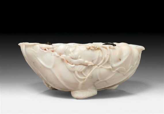 Appraisal: AN ELEGANT WHITE ALABASTER LOTUS BOWL WITH TWO TINY BRONZE