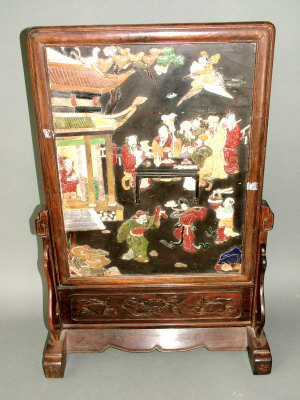 Appraisal: A Chinese lacquer rectangular panel decorated with feasting figures in