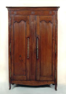 Appraisal: A FRENCH CHESTNUT ARMOIRE c of panelled rounded oblong form