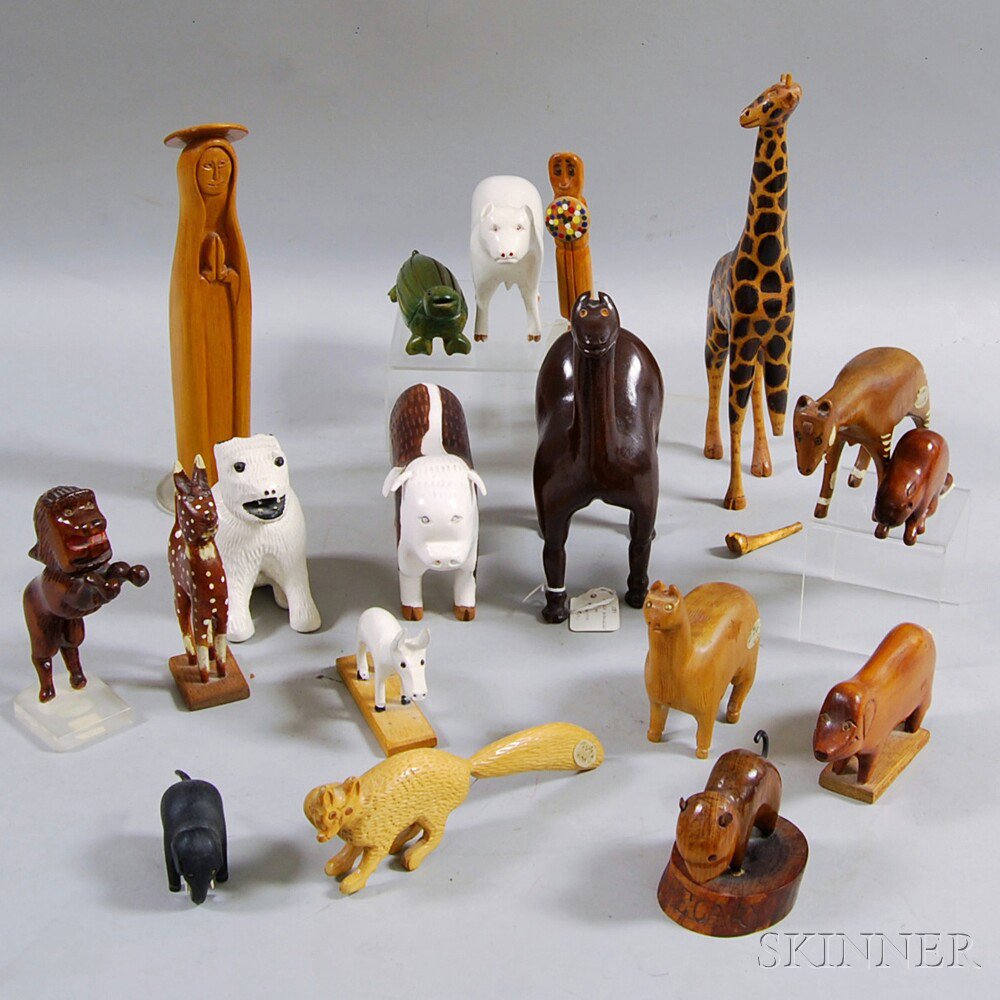 Appraisal: Eighteen Mostly Carved Wooden Animals including a bull a camel