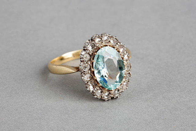 Appraisal: AN AQUAMARINE AND DIAMOND SET DRESS RING oval facet cut