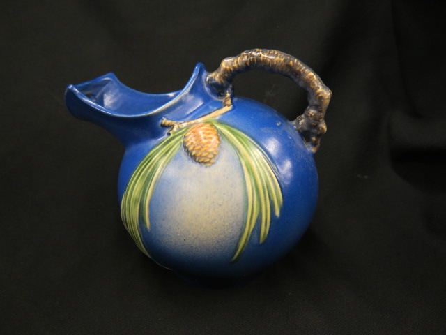 Appraisal: Roseville Pottery Pinecone Pitcher blue ball shape wide tall restoration