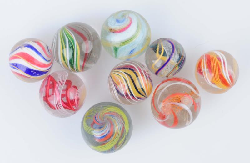 Appraisal: Lot Of Swirl Marbles Lot includes multicolor three stage latticino