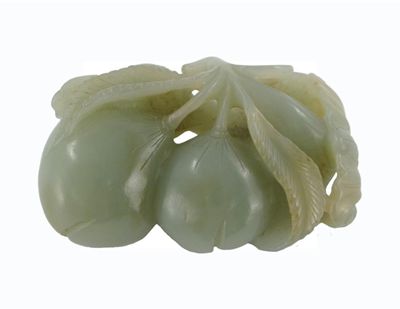 Appraisal: A Chinese celadon jade carving of two peaches and a