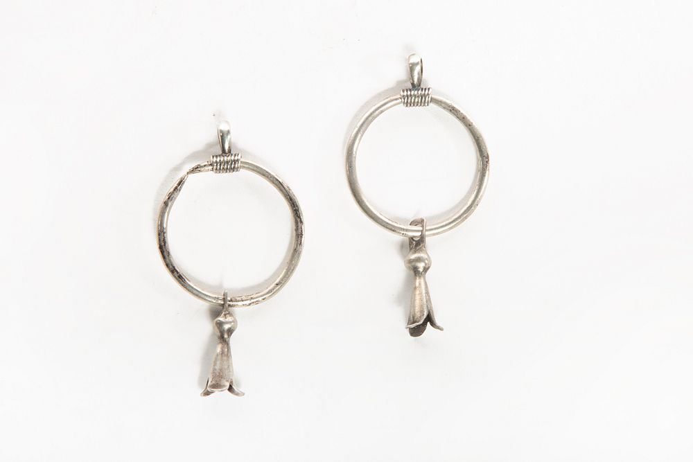 Appraisal: A Pair of Navajo Silver Hoop and Squash Blossom Earrings