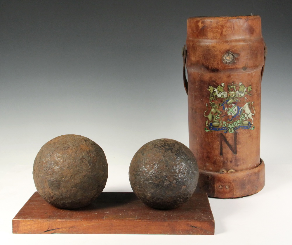 Appraisal: HISTORIC CANNON BALLS LEATHER CANNISTER - and Pound Solid Iron