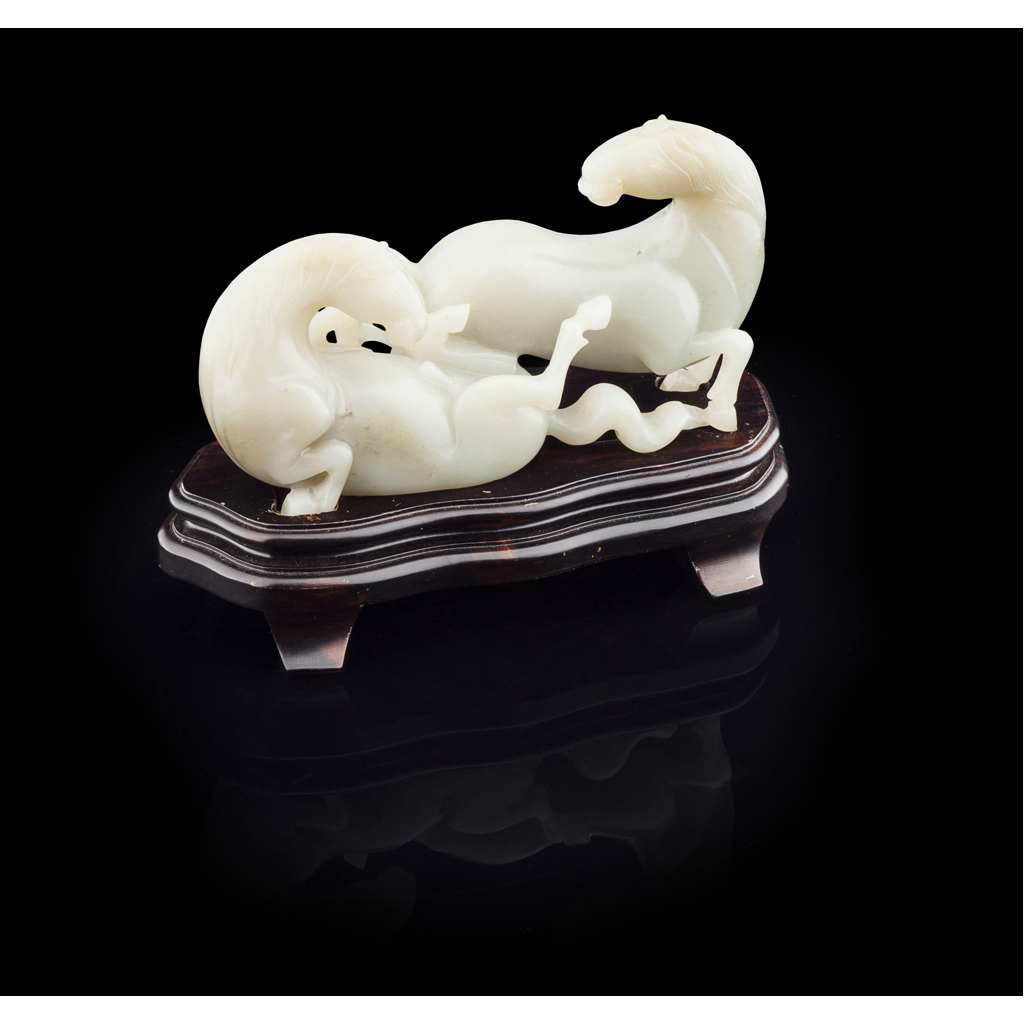 Appraisal: CELADON JADE GROUP QING DYNASTY depicting two playful horses one