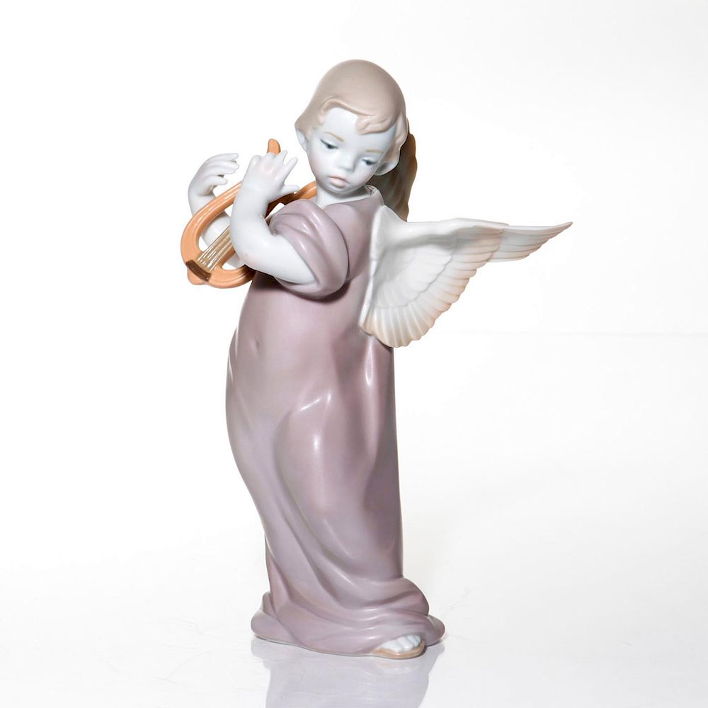 Appraisal: LLADRO FIGURINE ANGEL WITH LYRE Porcelain satin finish with soft