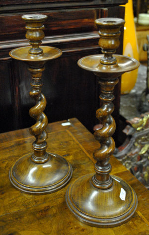 Appraisal: A pair of turned fruitwood barley twist candlesticks cm