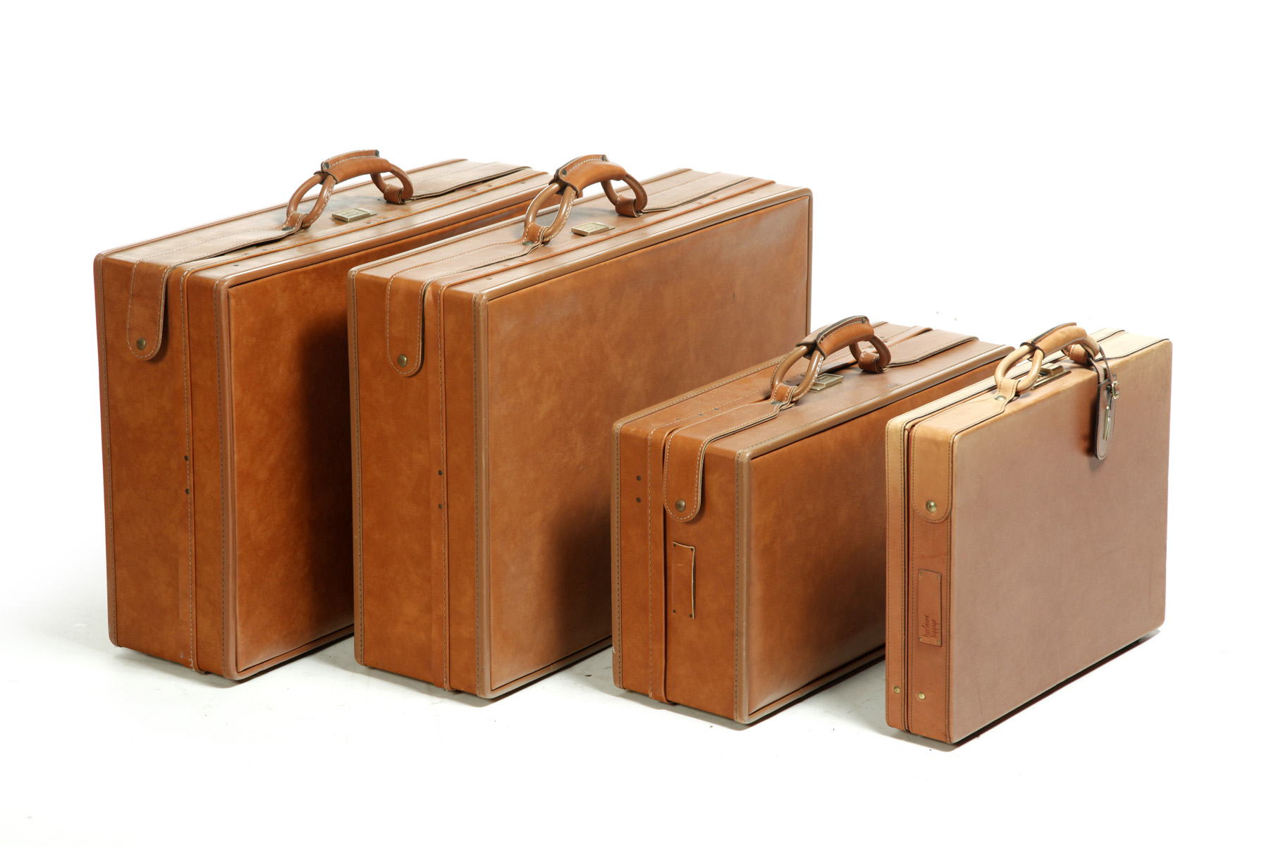 Appraisal: FOUR HARD SHELL PIECES OF HARTMANN LEATHER LUGGAGE American th