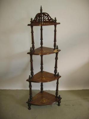 Appraisal: A VICTORIAN WALNUT WHATNOT of four tier quadrant form the