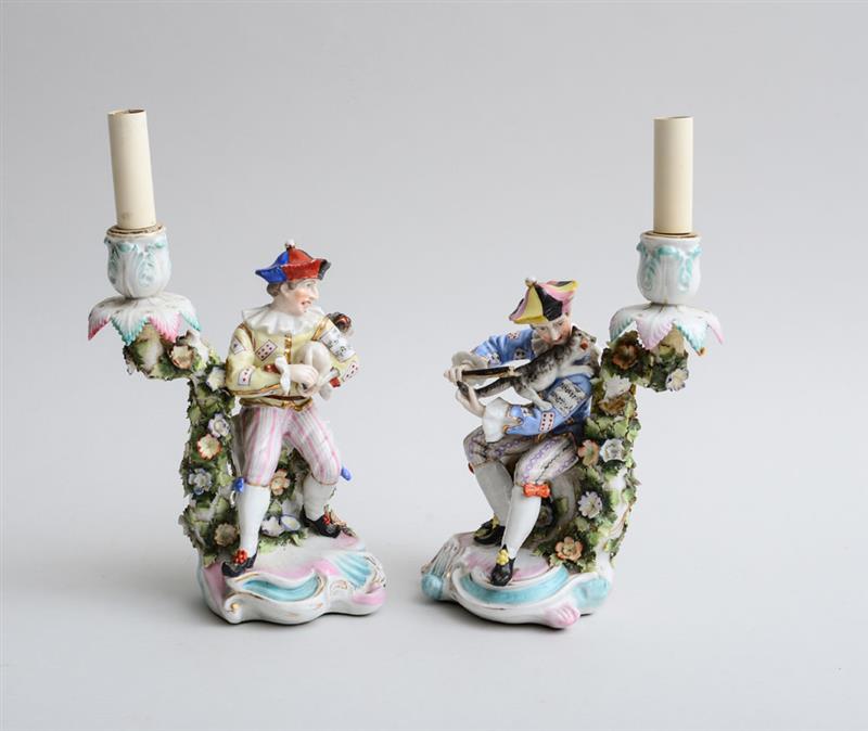 Appraisal: PAIR OF MEISSEN TYPE PORCELAIN HUMOUOUS FIGURAL CANDLESTICKS MOUNTED AS