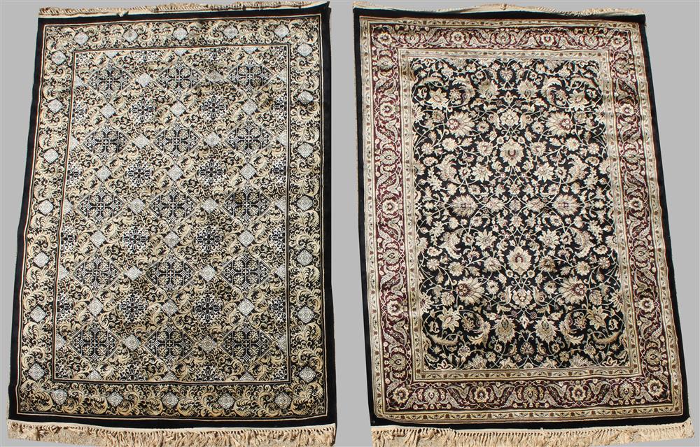 Appraisal: TWO COORDINATING SILK AND WOOL MACHINE MADE ORIENTAL RUGS the