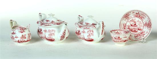 Appraisal: CHILD'S RED STAFFORDSHIRE TEA SET English th century With a