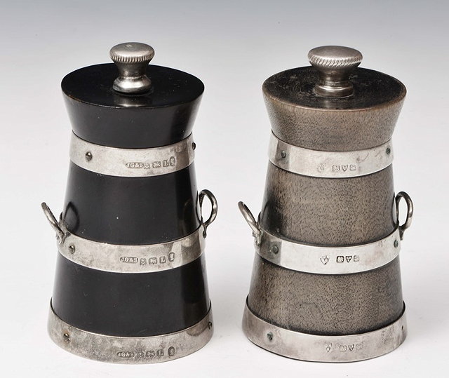 Appraisal: TWO SILVER MOUNTED PEPPER GRINDERS in the form of milk